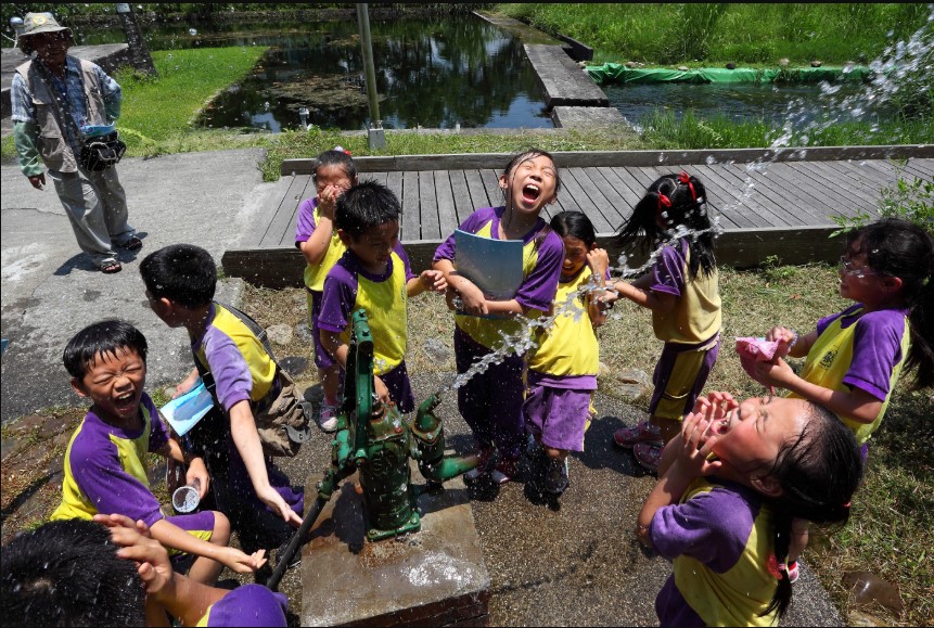 Children happy to play with water
